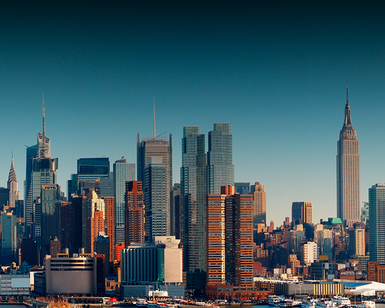 A city skyline with buildings in the background